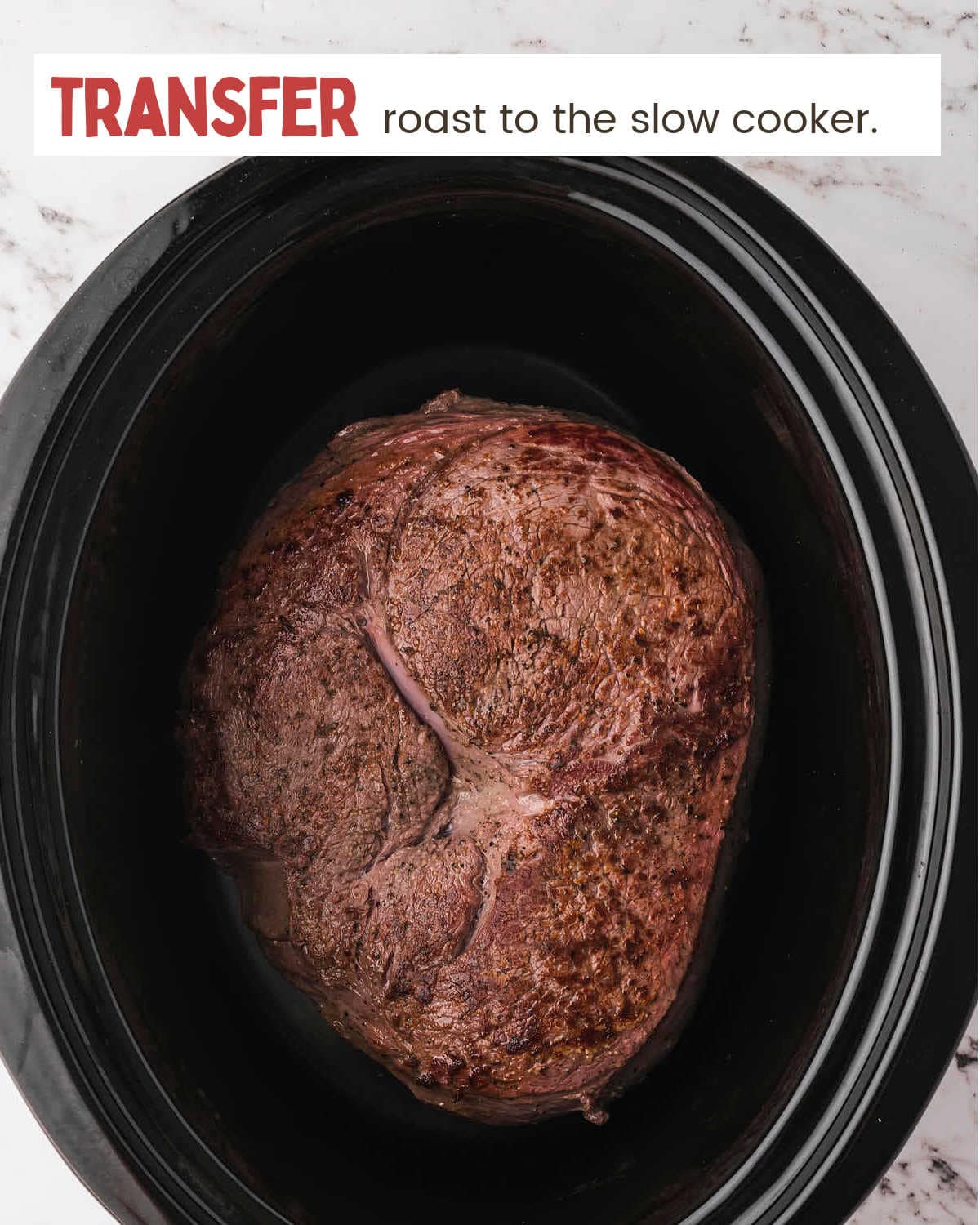 Seared roast in crockpot for Slow Cooker Sirloin Tip Roast.