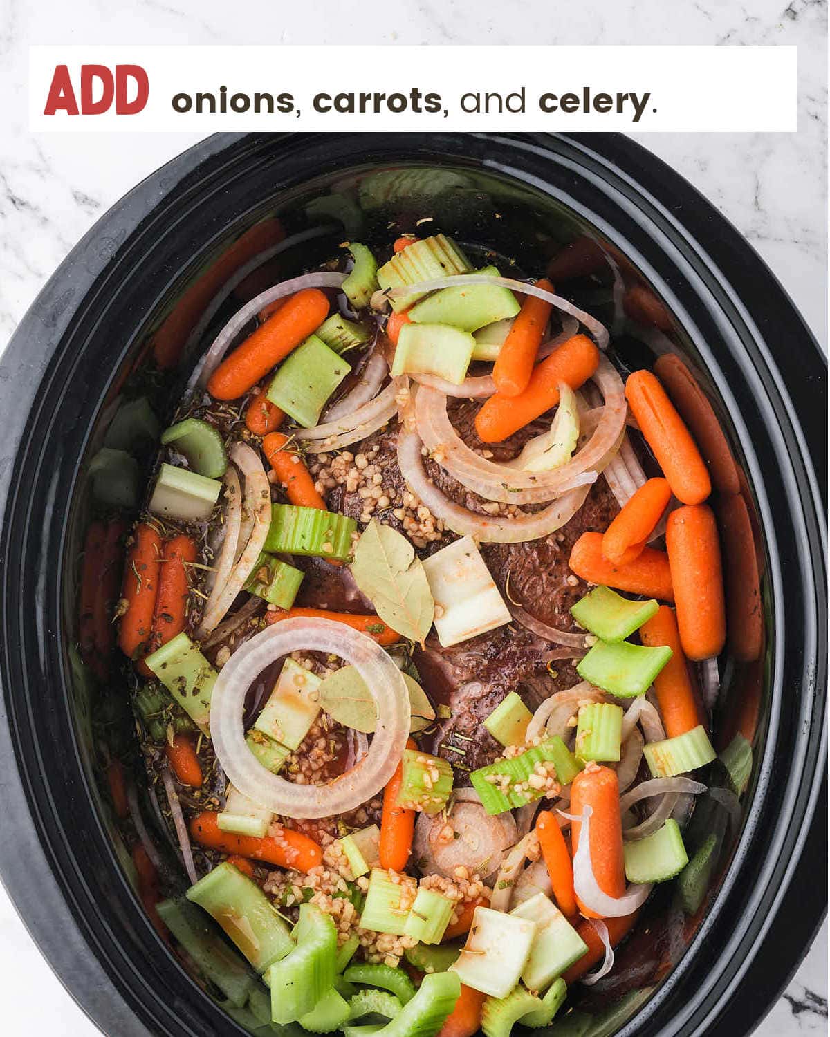 Veggies and beef in crockpot for Slow Cooker Sirloin Tip Roast.