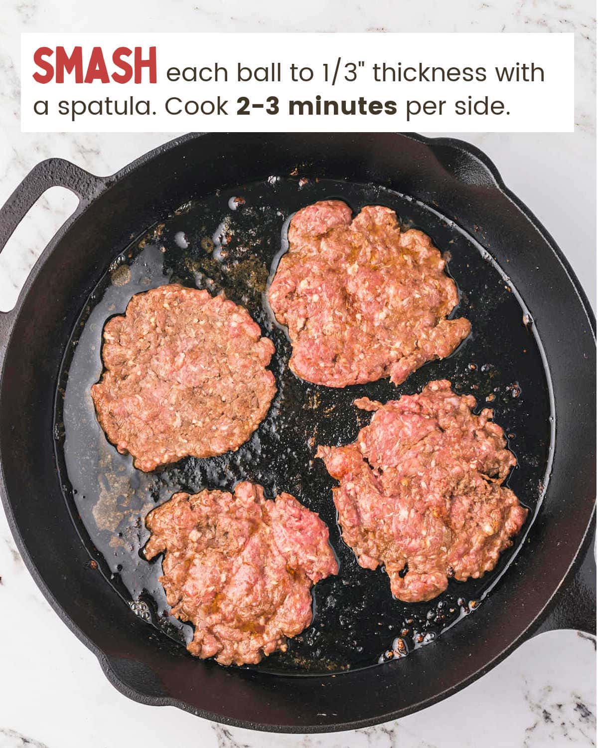 Cooking patties in a cast iron skillet for Smash Burgers.