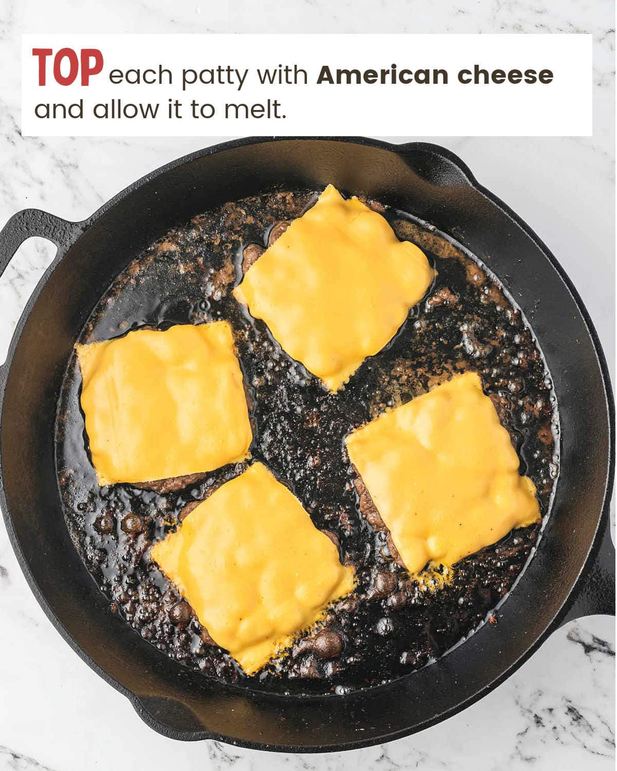 Melting American cheese over patties for Smash Burgers.