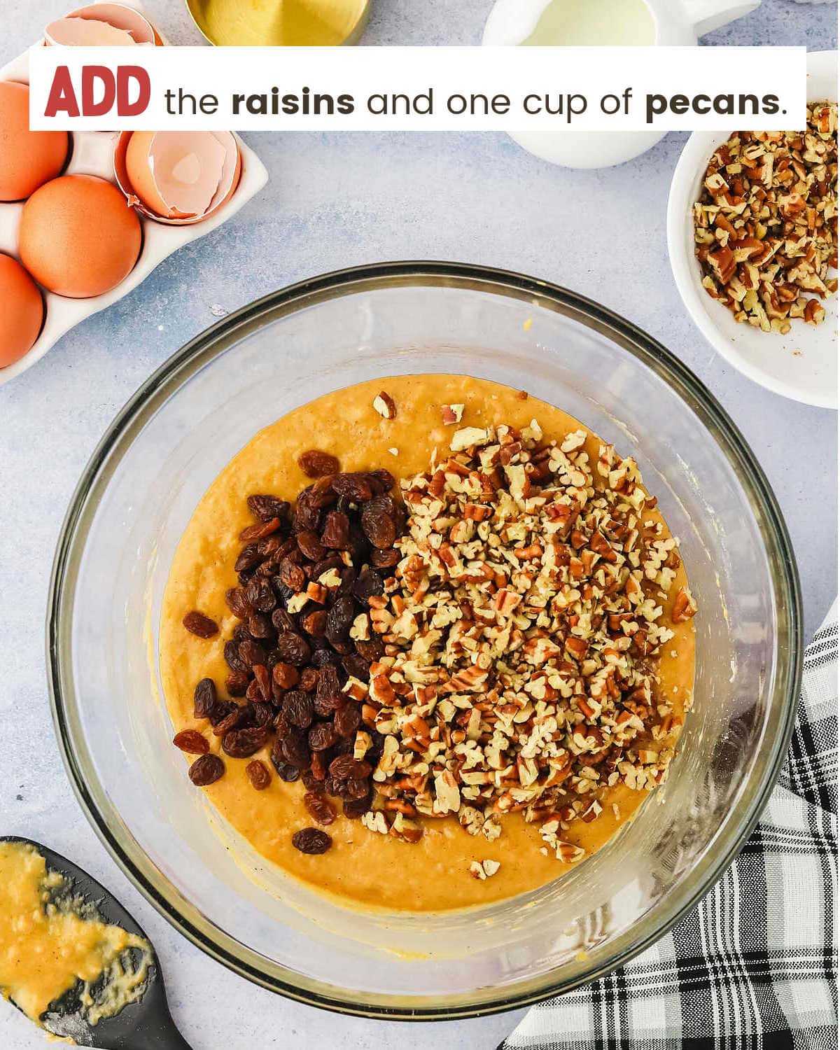 Adding raisins and pecans to Sweet Potato Bread batter.