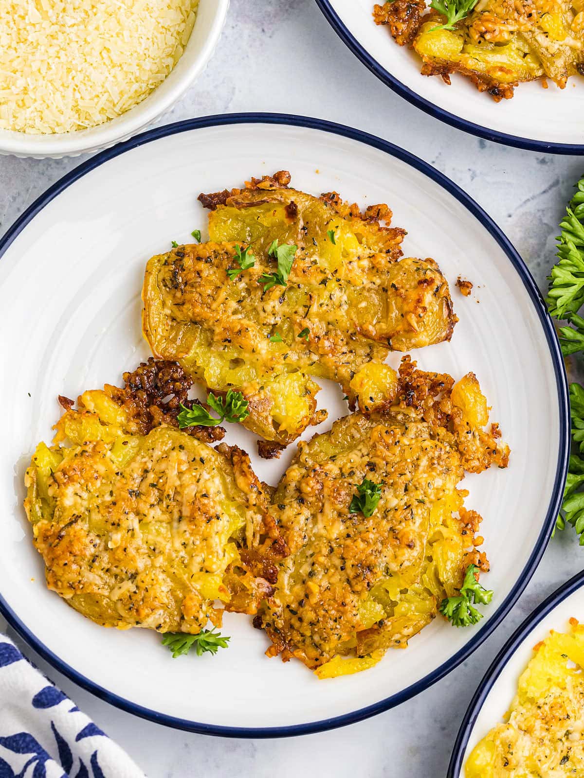 TikTok's Parmesan Crusted Potatoes served on a white plate.