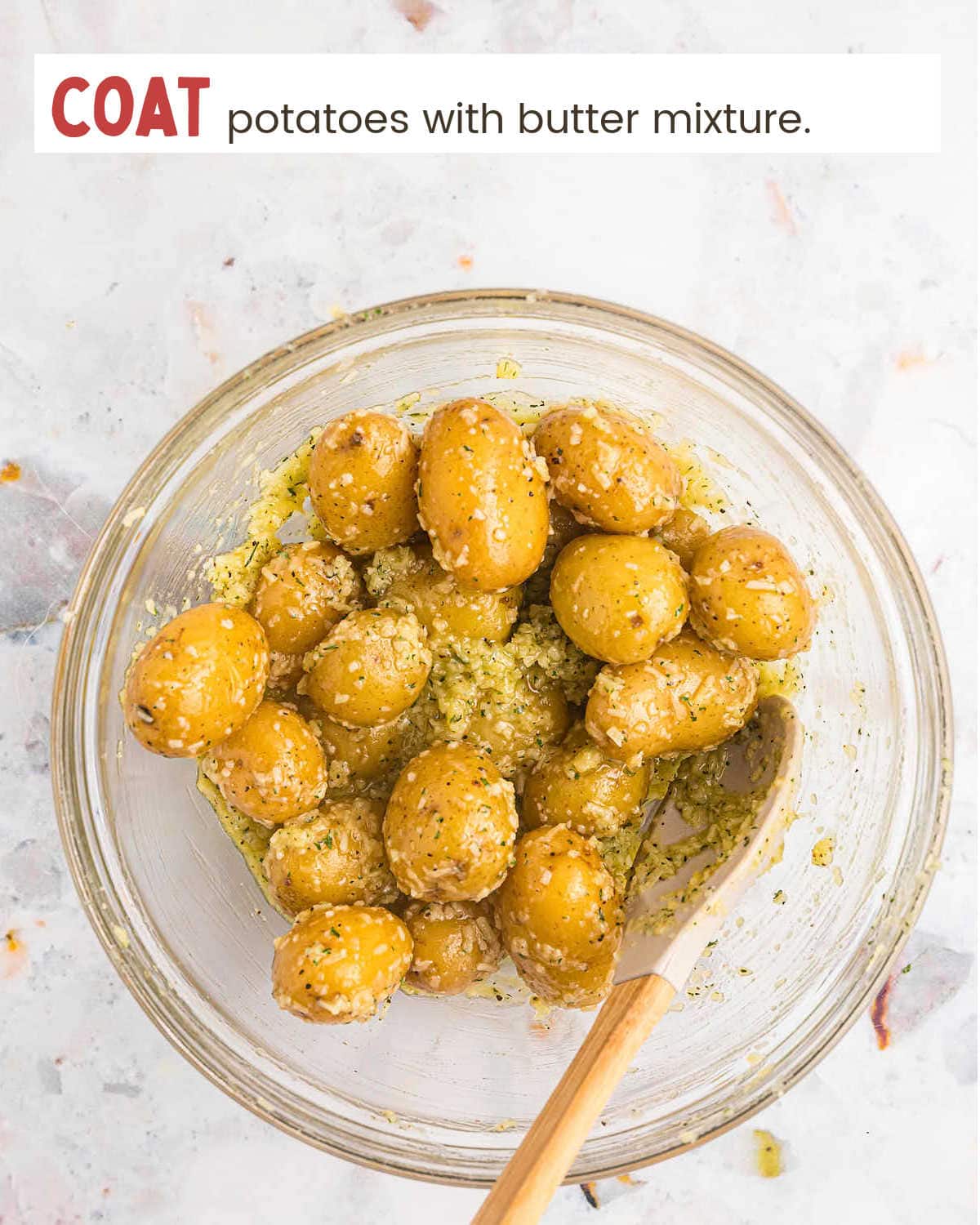 Tossing potatoes in butter cheese mixture for Parmesan Crusted Potatoes.