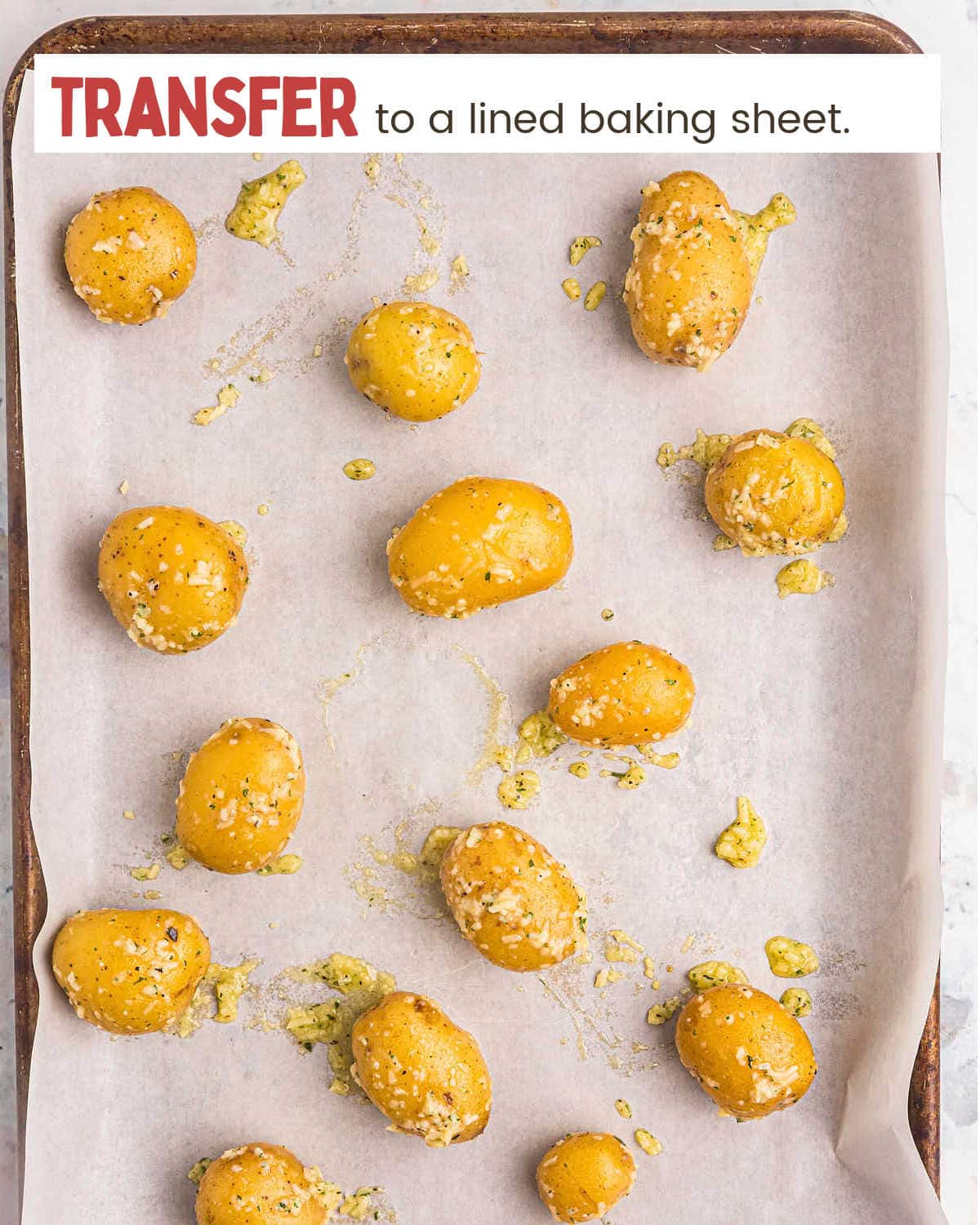 Whole Parmesan Crusted Potatoes on a baking sheet.