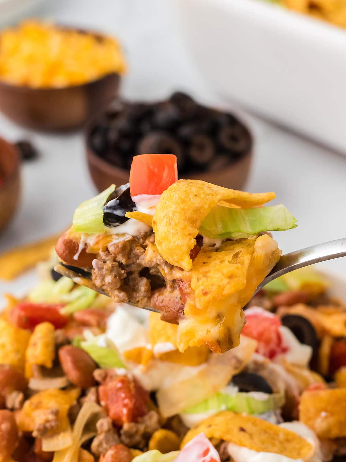 Closeup of a spoonful of Walking Taco Casserole.