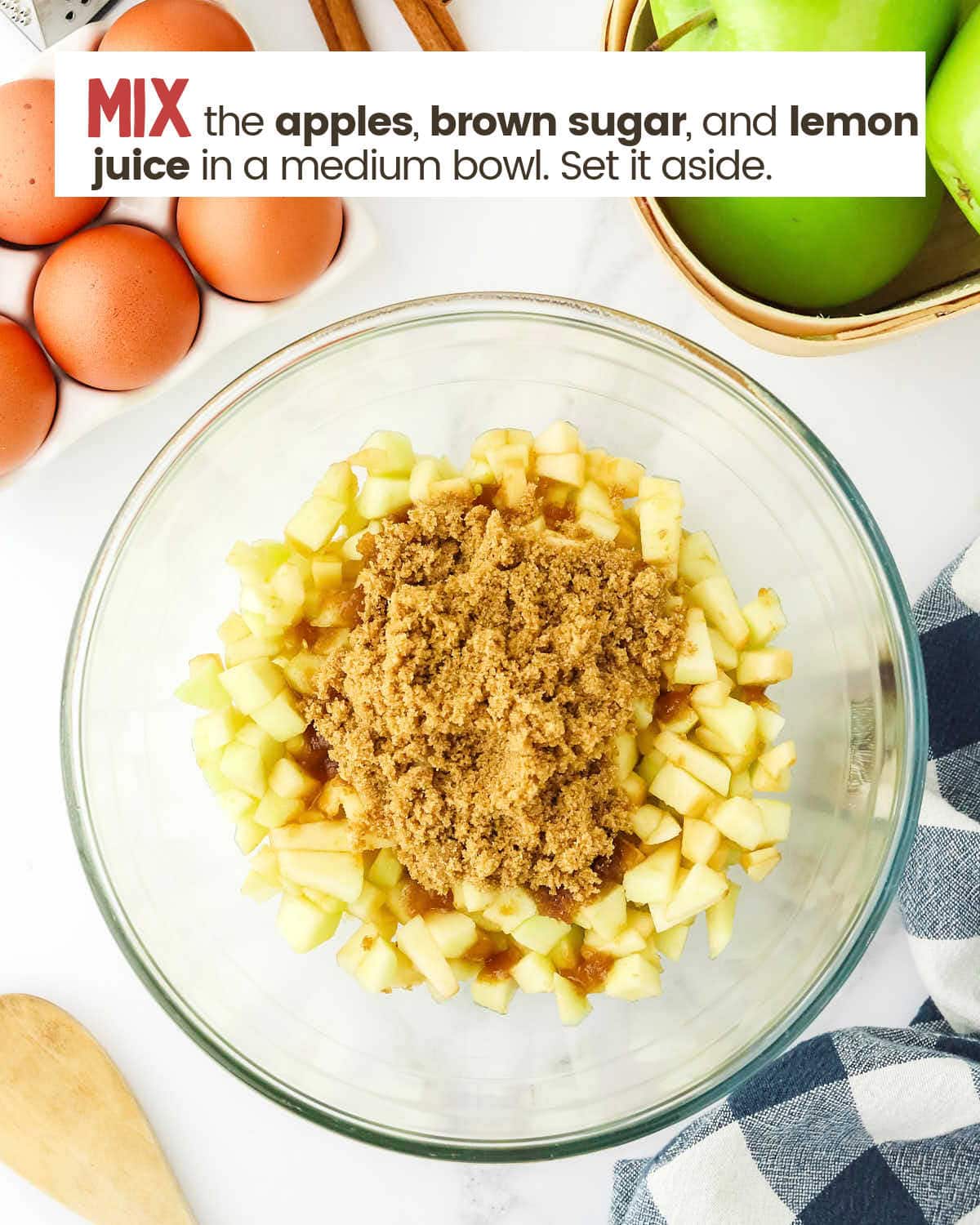 Apple chunks, brown sugar, and lemon juice in a bowl. 