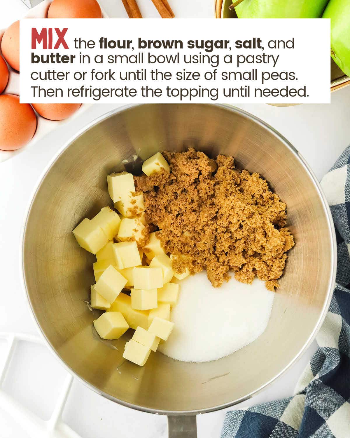 Cubed butter, flour, and brown sugar in a bowl.