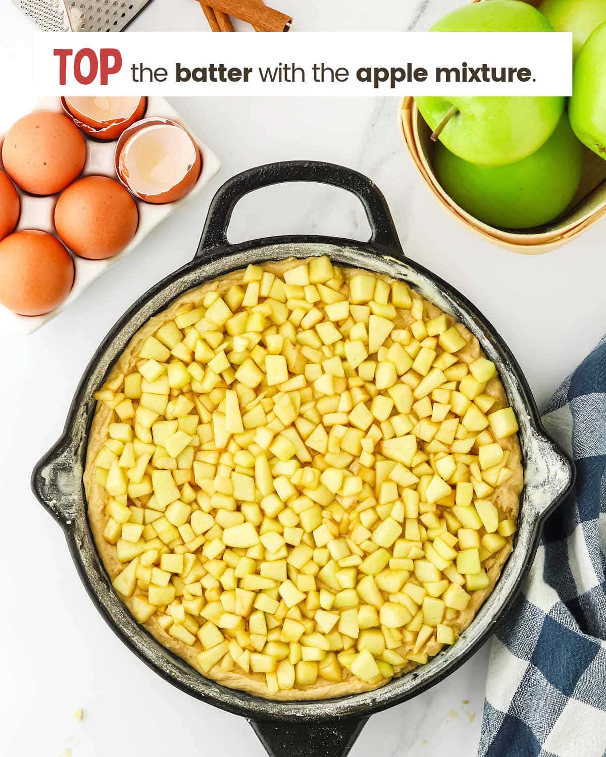 Apple chunks on top of skillet.