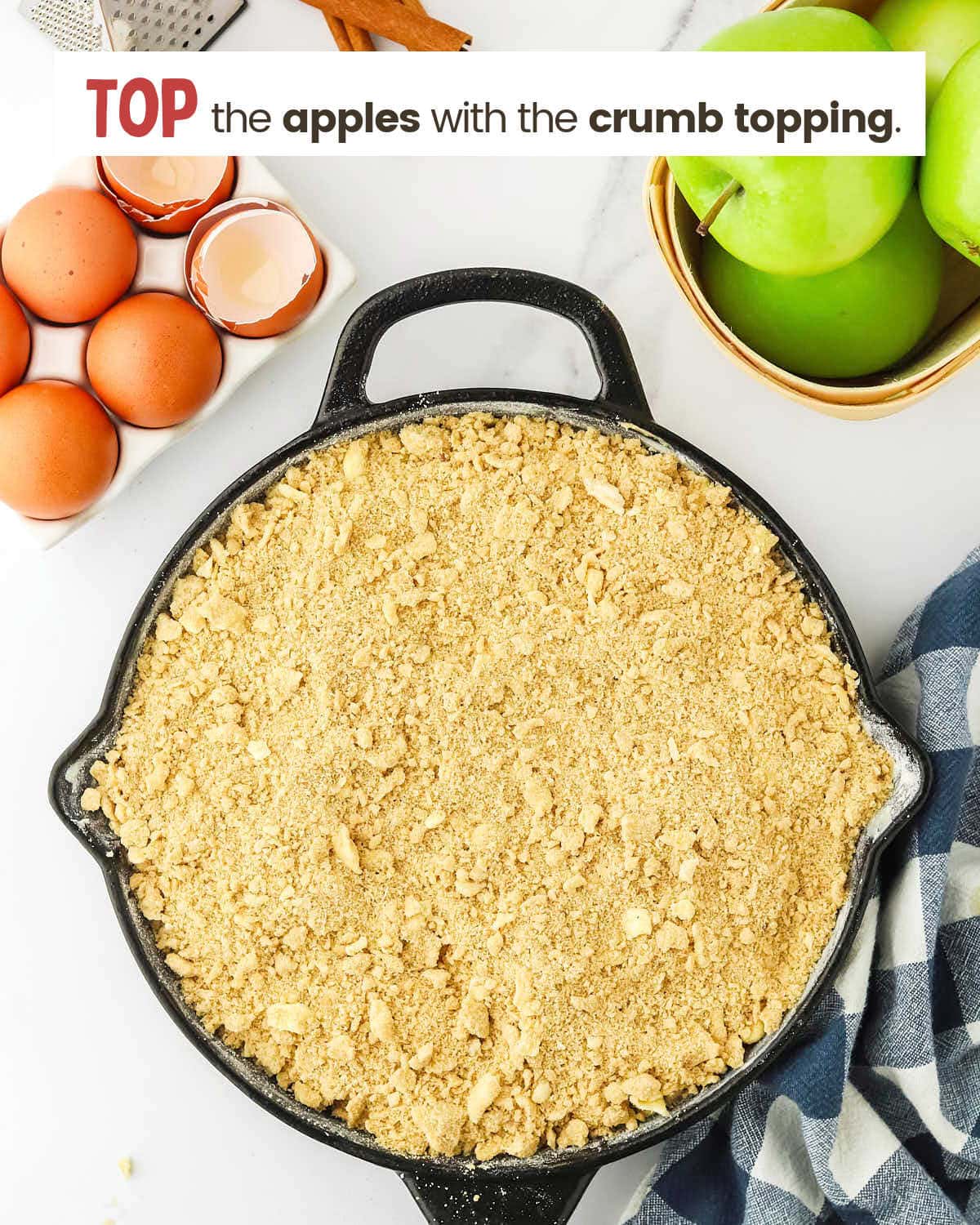 Crumb topping for apple crumb cake in a skillet.
