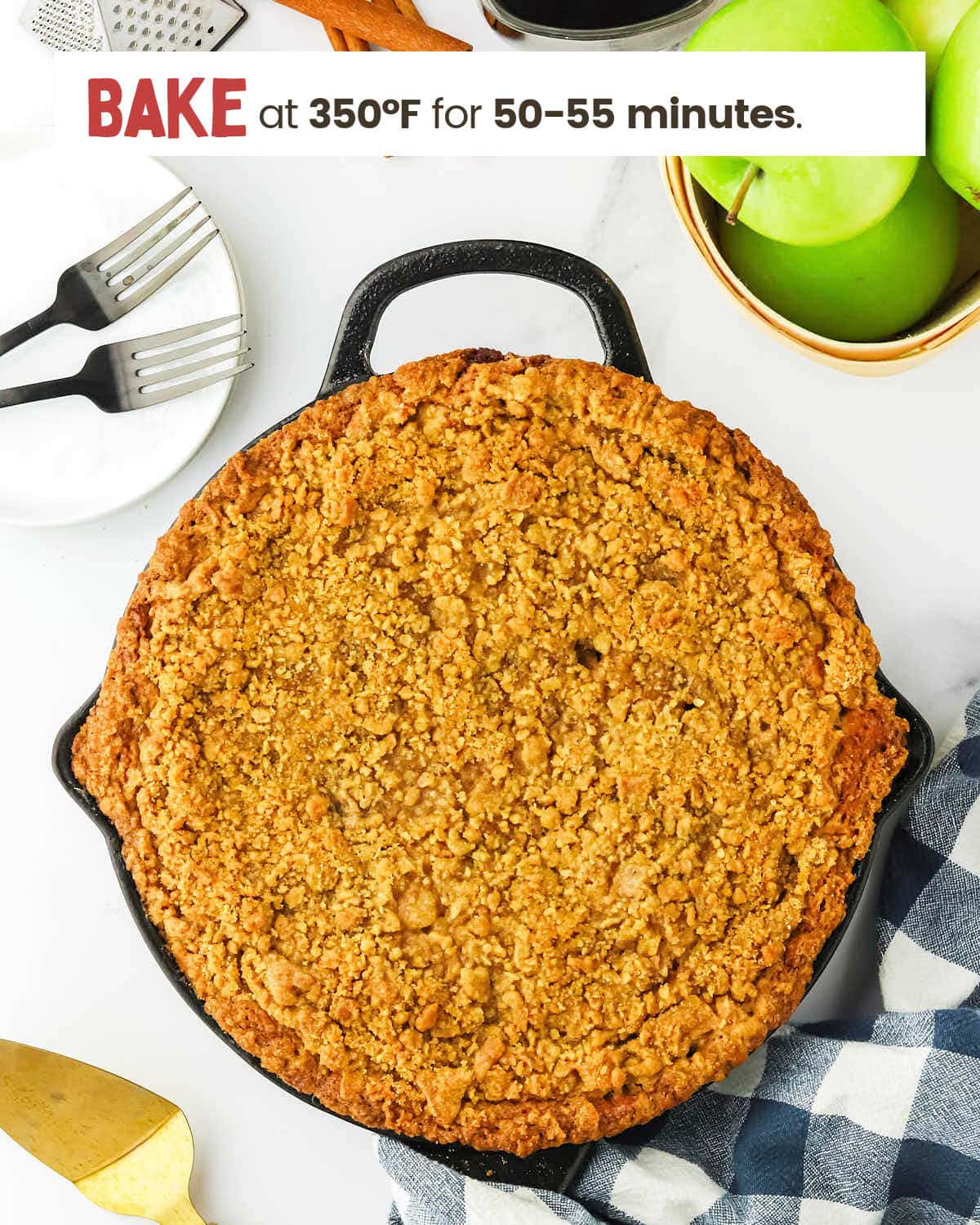 Baked apple crumb cake in a skillet.