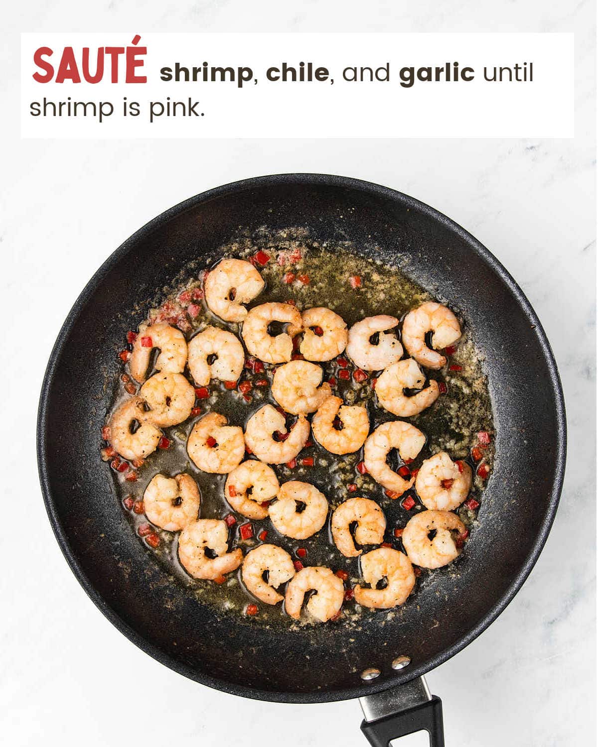 Sautéing shrimp in skillet for Shrimp Asparagus Pasta.