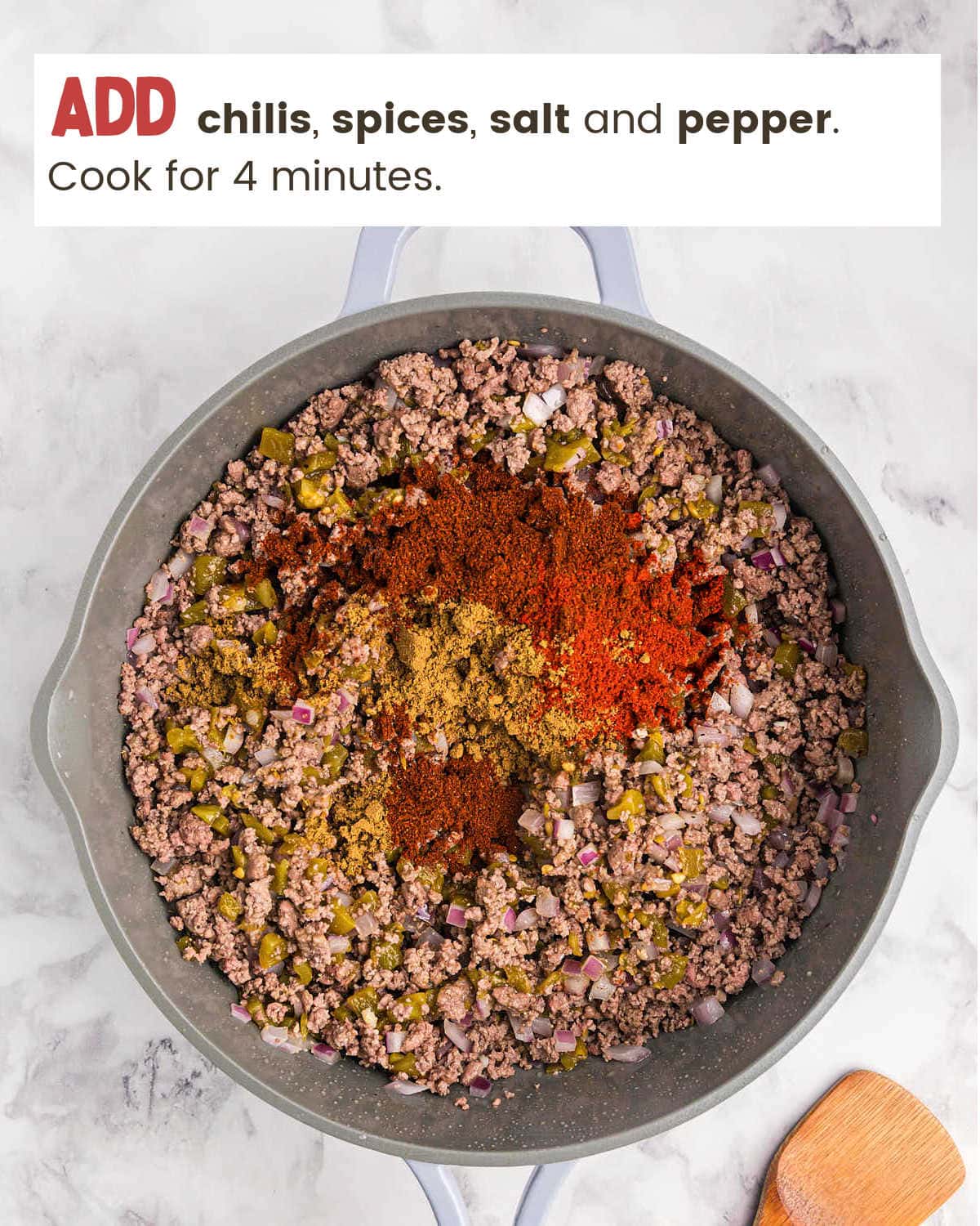 Seasoning beef for a Beef Enchilada Casserole.