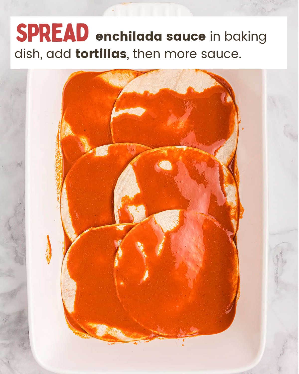 Layering tortillas and enchilada sauce for a Beef Enchilada Casserole.