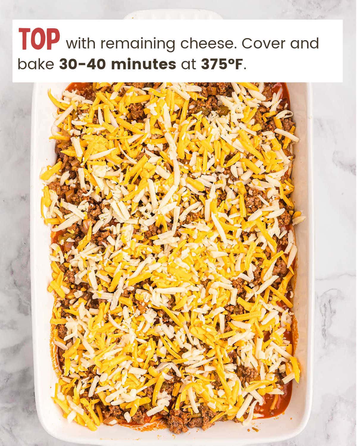 Layering cheese for a Beef Enchilada Casserole.