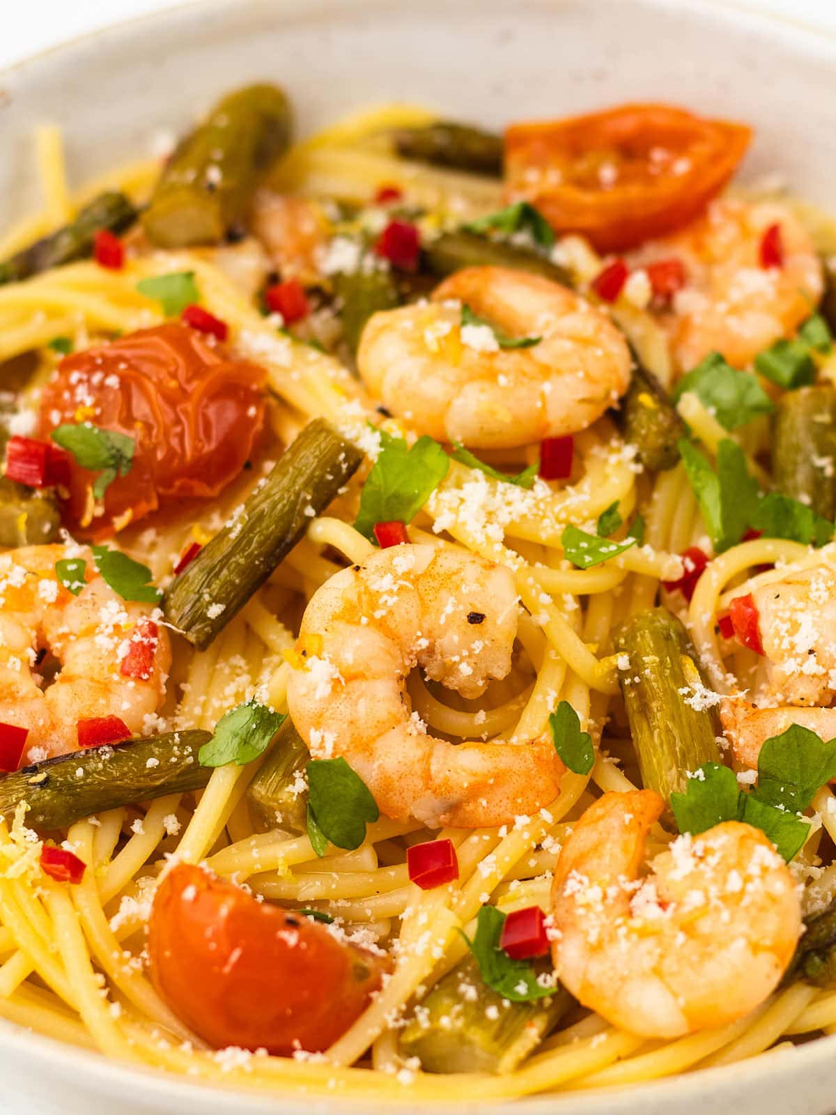 Shrimp Asparagus Pasta recipe served in a white bowl. 