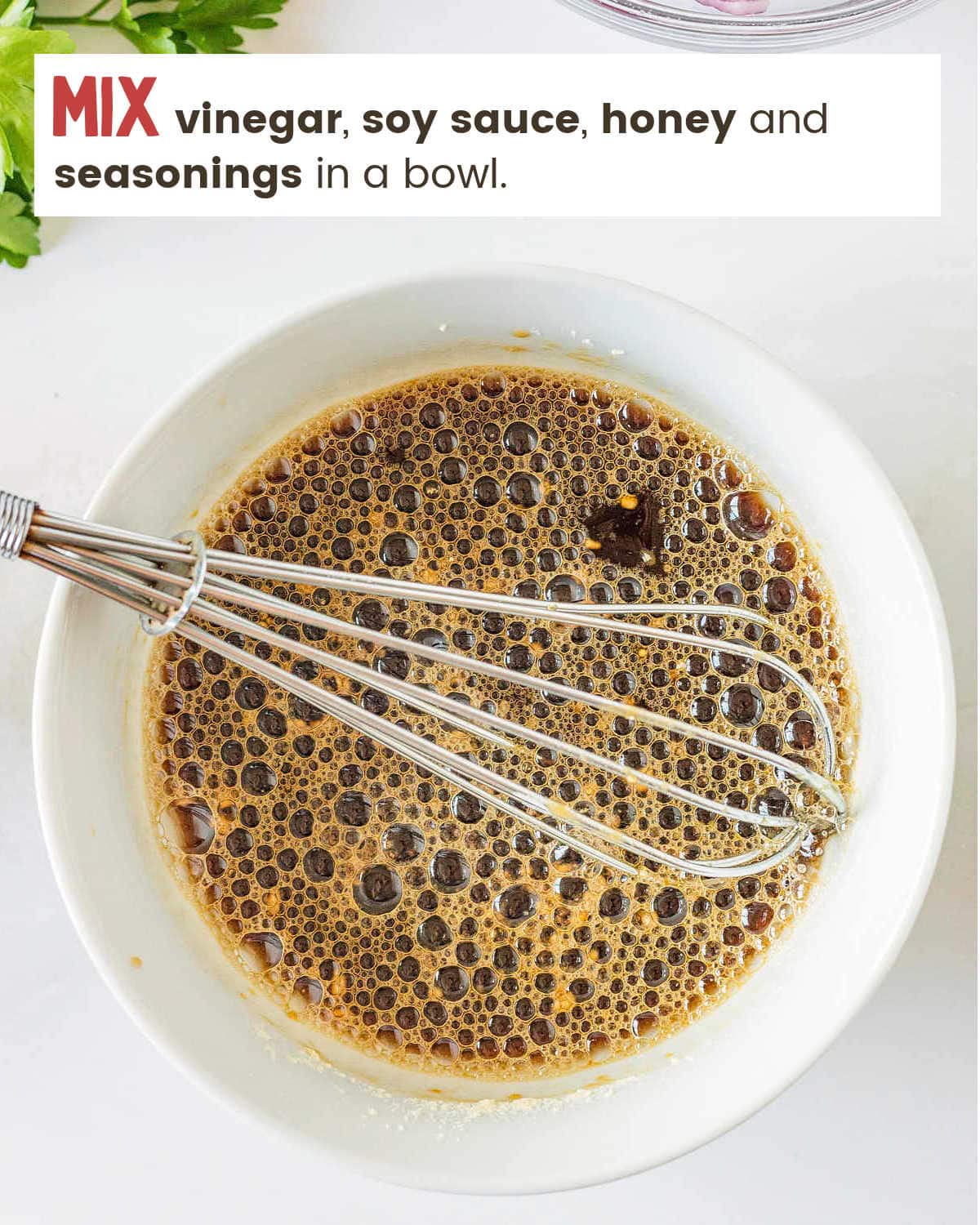 Mixing sauce for Slow Cooker Adobo Chicken in a bowl.