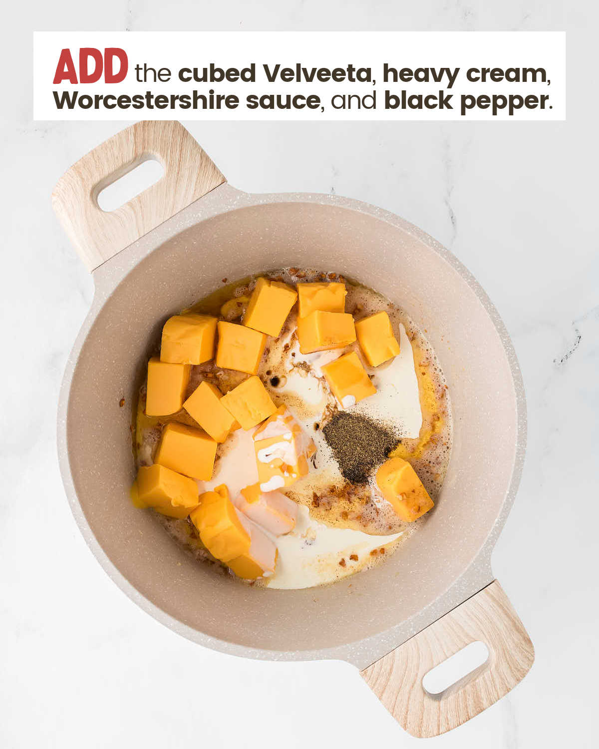 Garlic, Velveeta cubes, heavy cream, and black pepper in a pot.