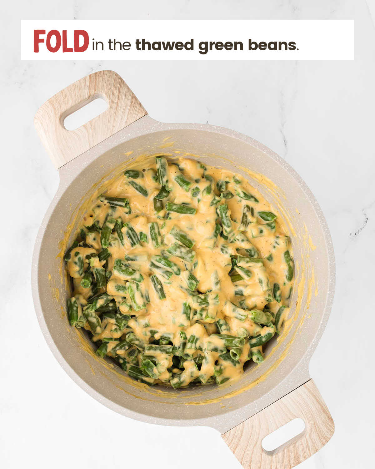Melted Velveeta cheese and green beans mixture in a pot.