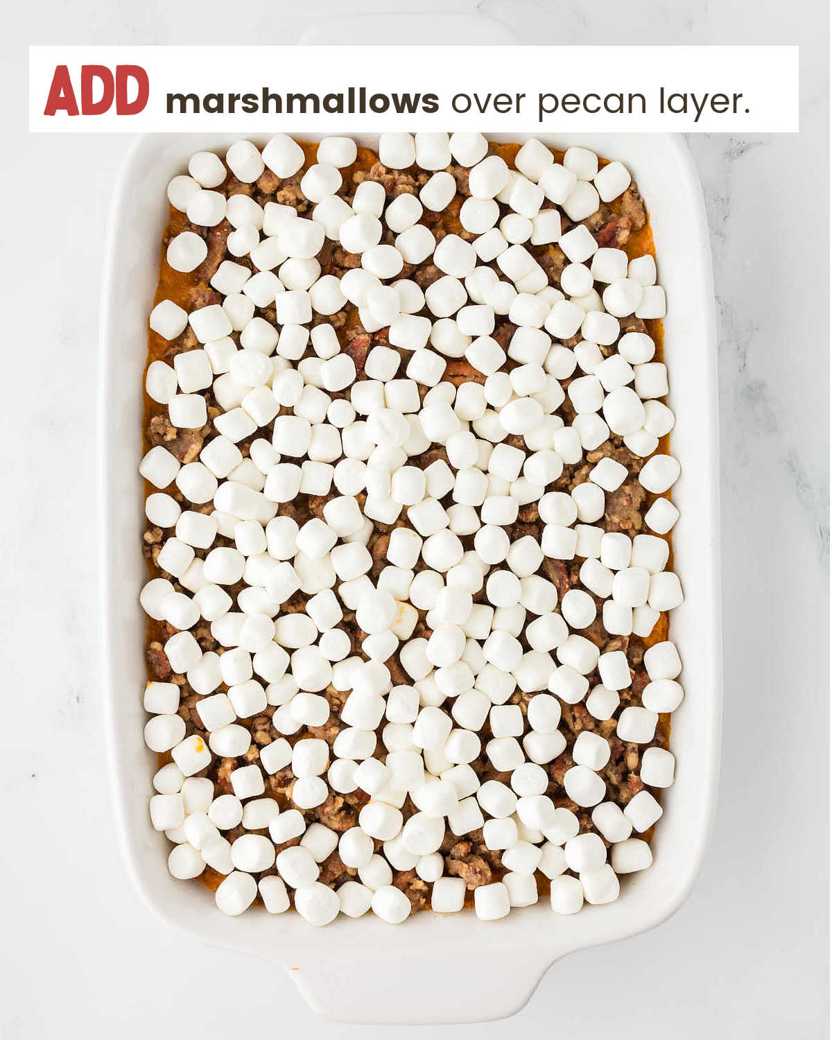 Adding marshmallows for Sweet Potato Casserole.