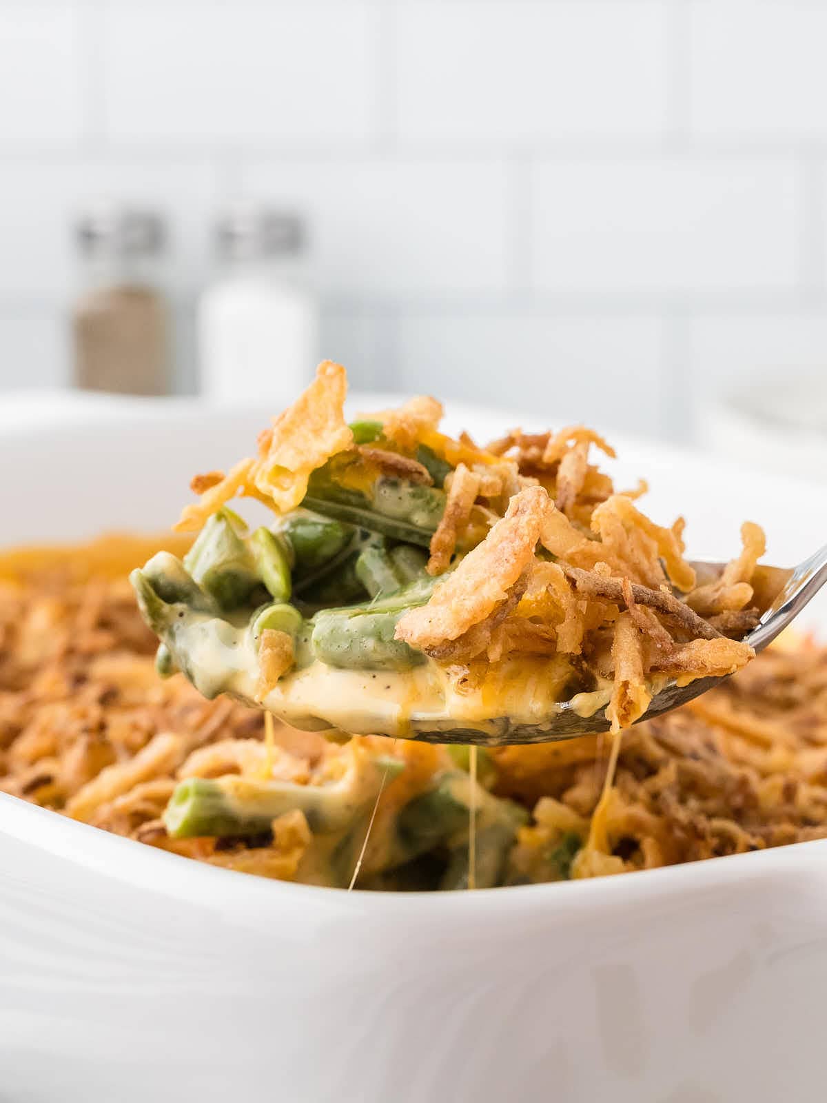 A serving spoonful of Green Bean Casserole.