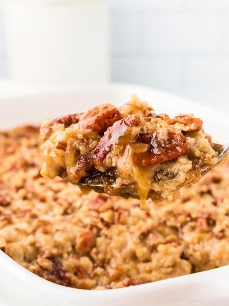 Closeup of a slice of Pecan Pie Dump cake scoop.