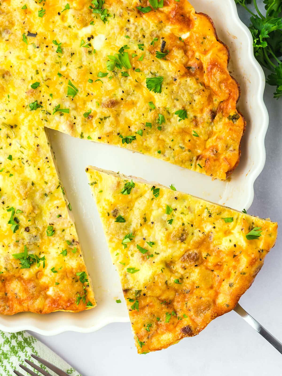 A slice of Turkey Quiche on a cake lifter.