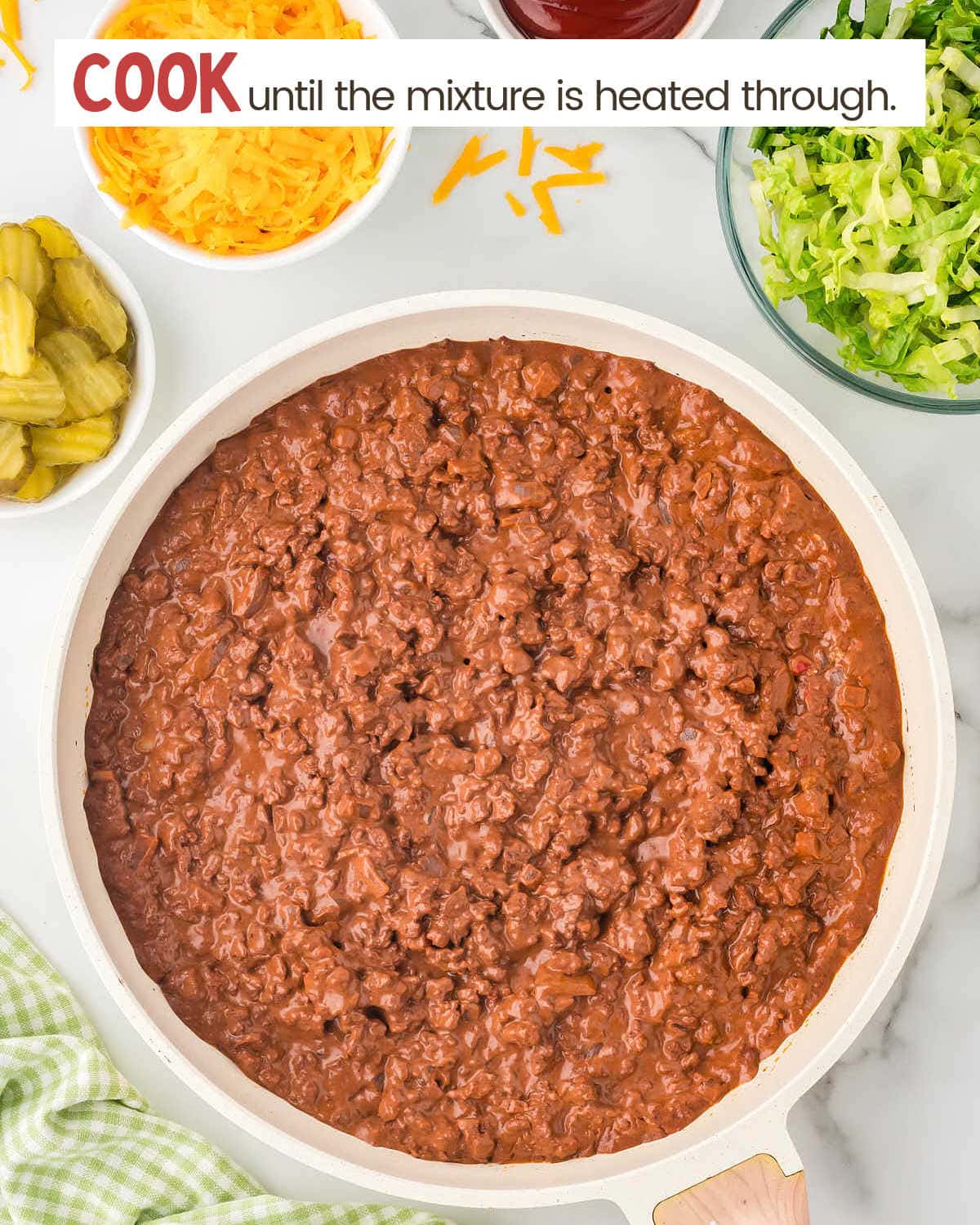 Cooked ground beef mixture in a skillet.
