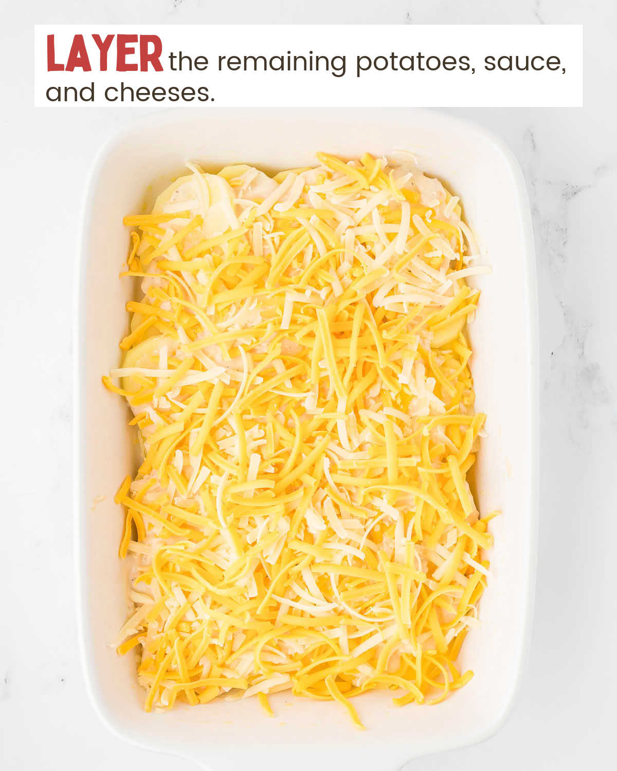 Thinly sliced potatoes covered with cheese in a baking dish with instructions in a text box.