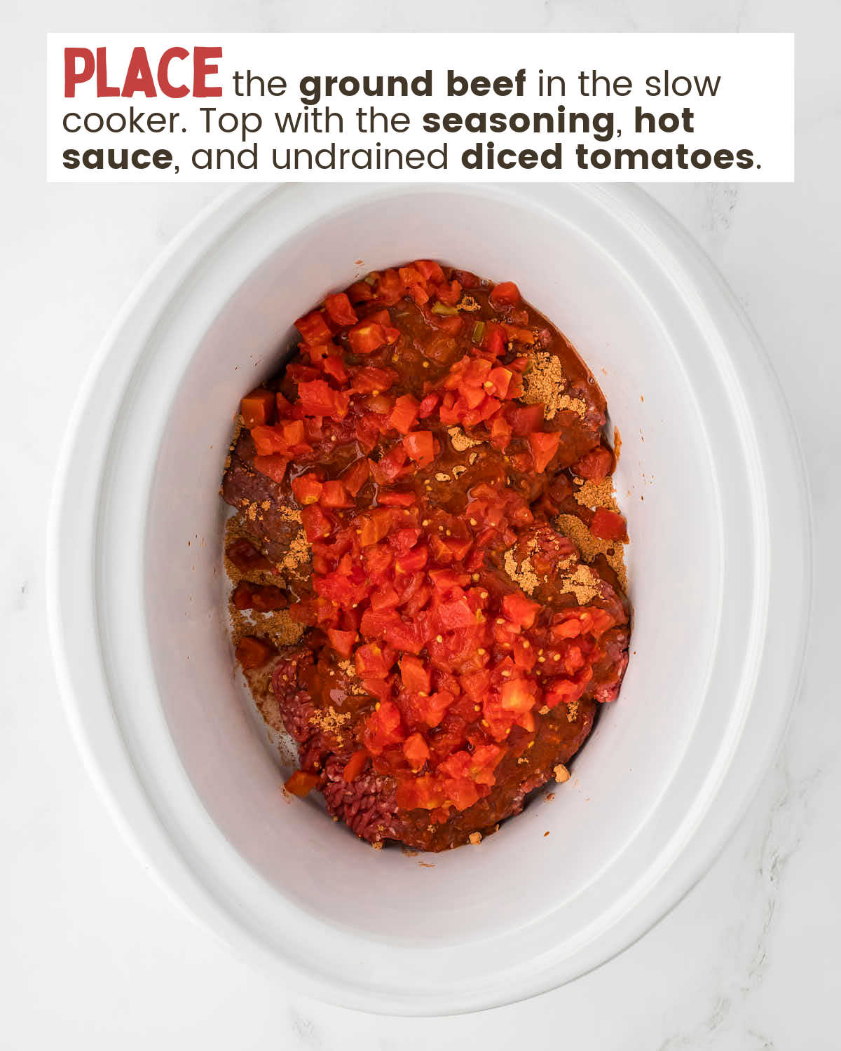 A top-down view of a slow cooker with ingredients for taco meat. 