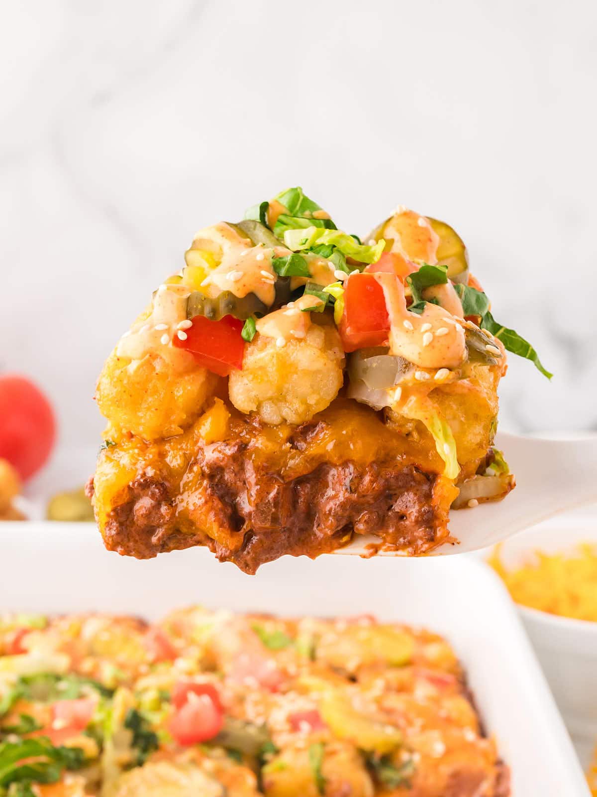 Closeup of a spoonful of a Big Mac Casserole.