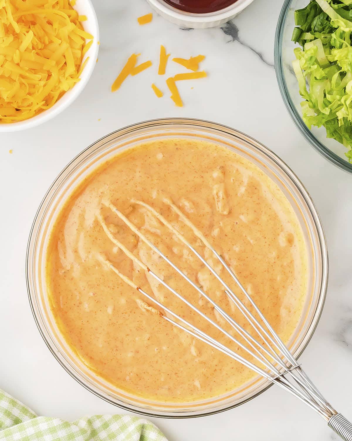 Whisking the sauce.