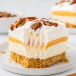 A slice of Pumpkin Delight on a white plate.