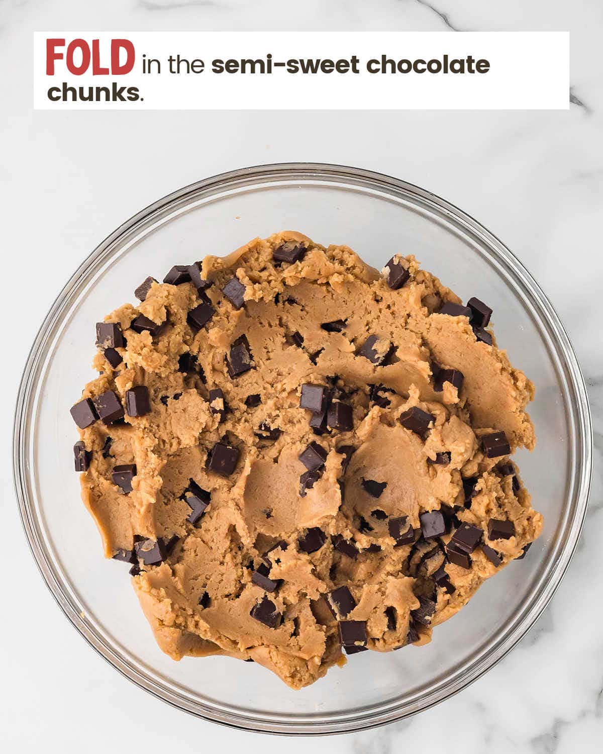 Chocolate chip cookie dough in a bowl.