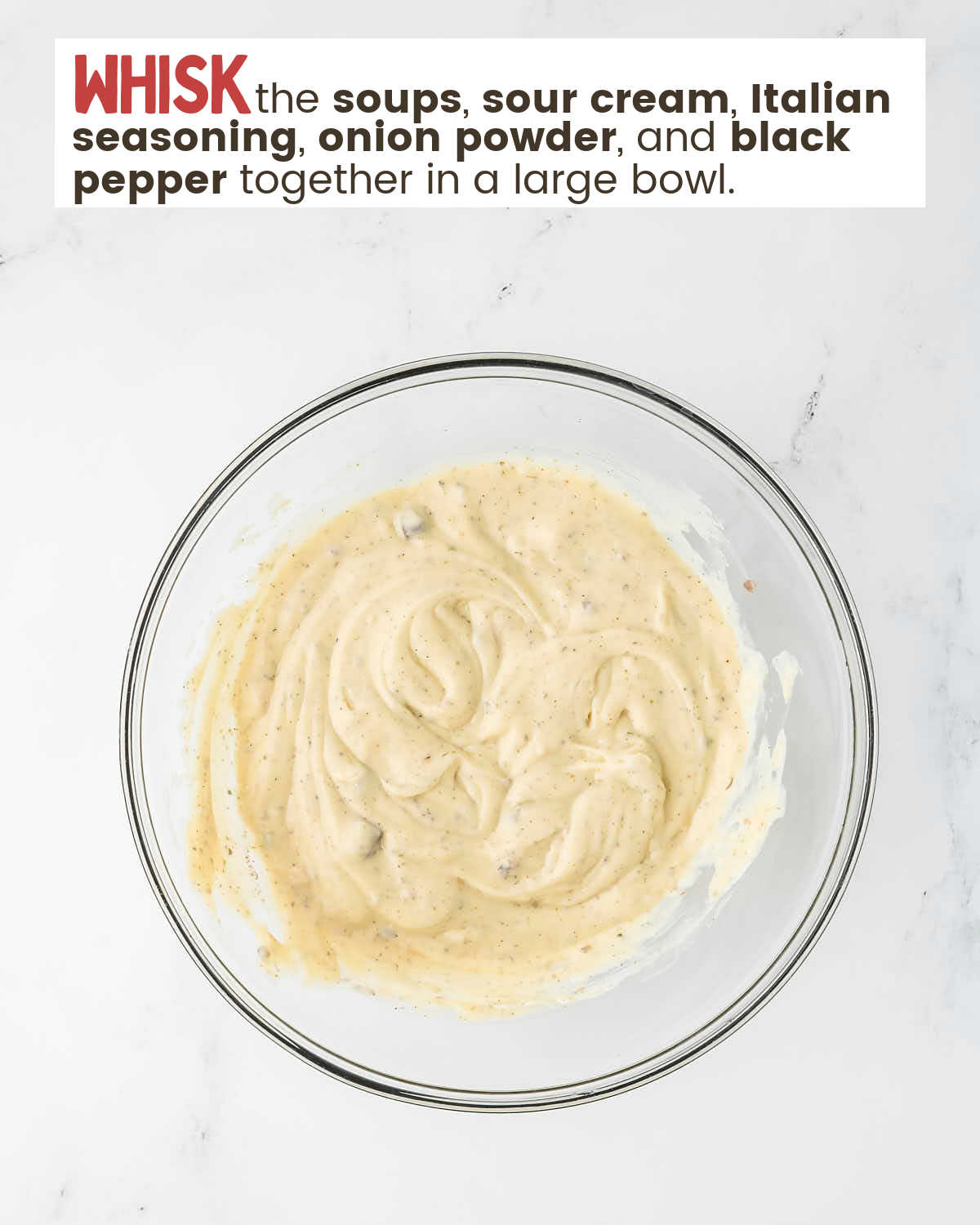 Whisking ingredients in a large bowl for step 2 in the chicken and stuffing casserole. 