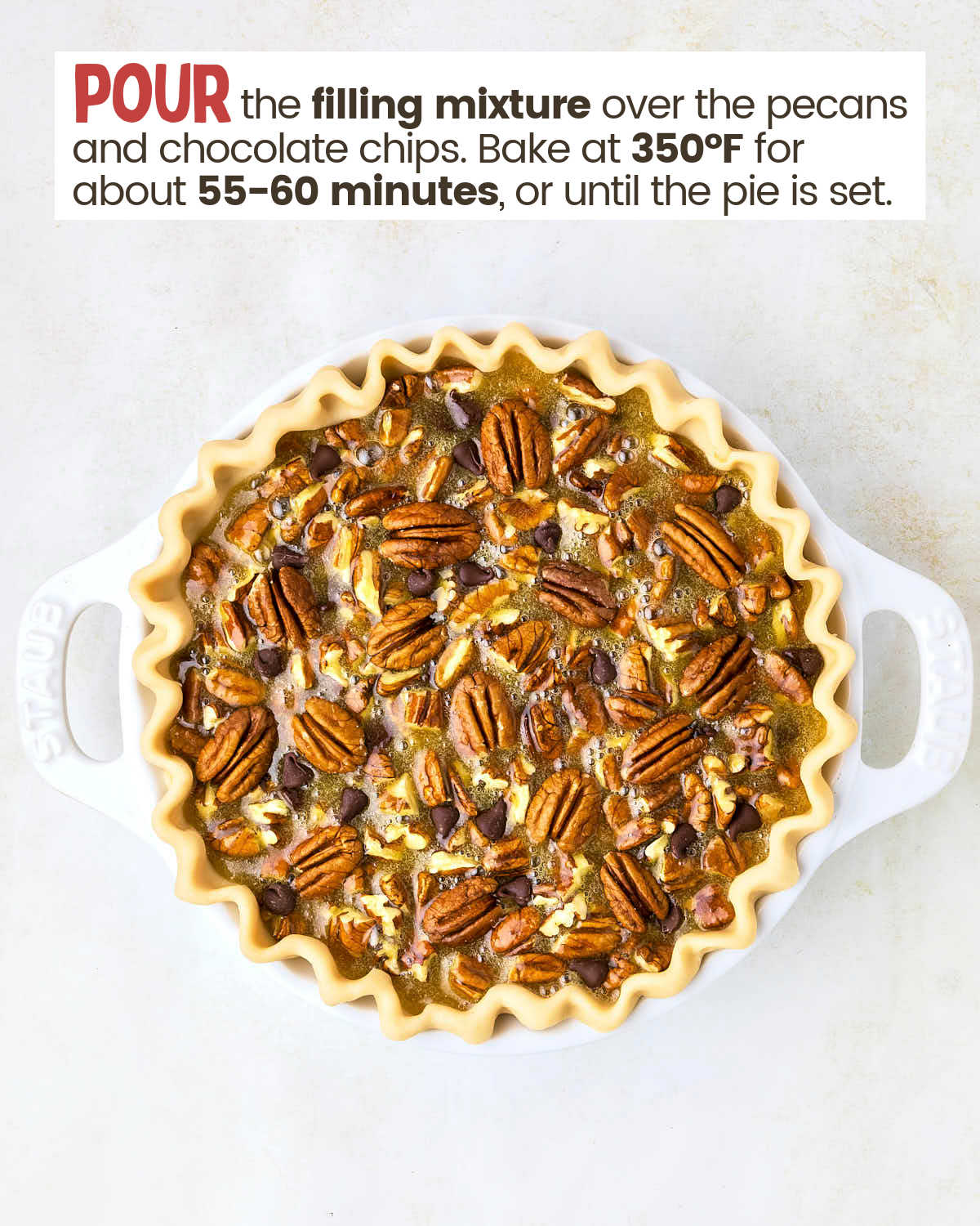 Chocolate pecan pie in a pie dish before baking it. 
