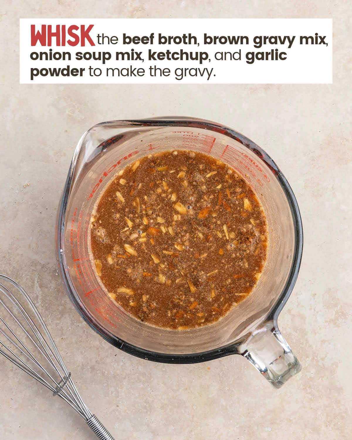 Gravy in a large measuring cup.