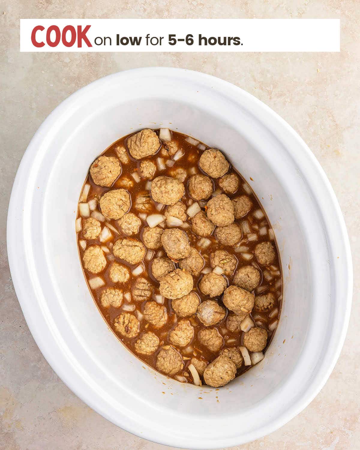 Gravy and frozen meatballs in a slow cooker.