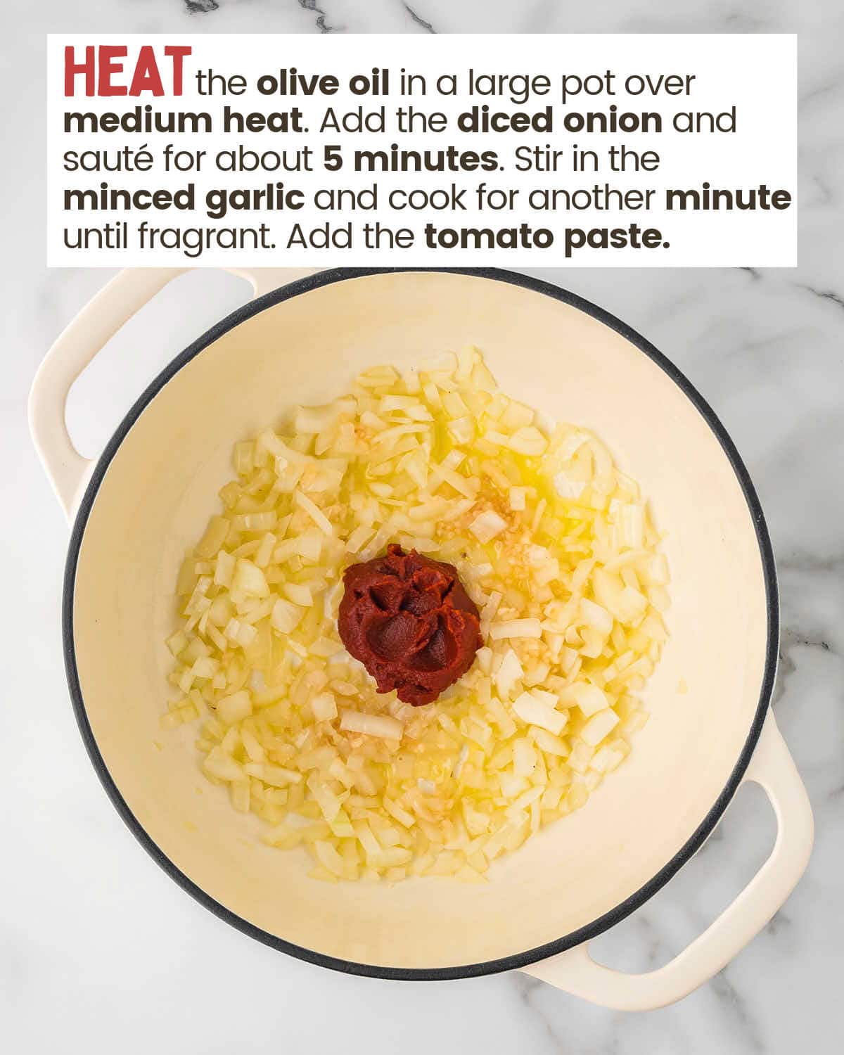 Olive oil, onions, garlic, and tomato paste in a large pot as a base for ham and bean soup.