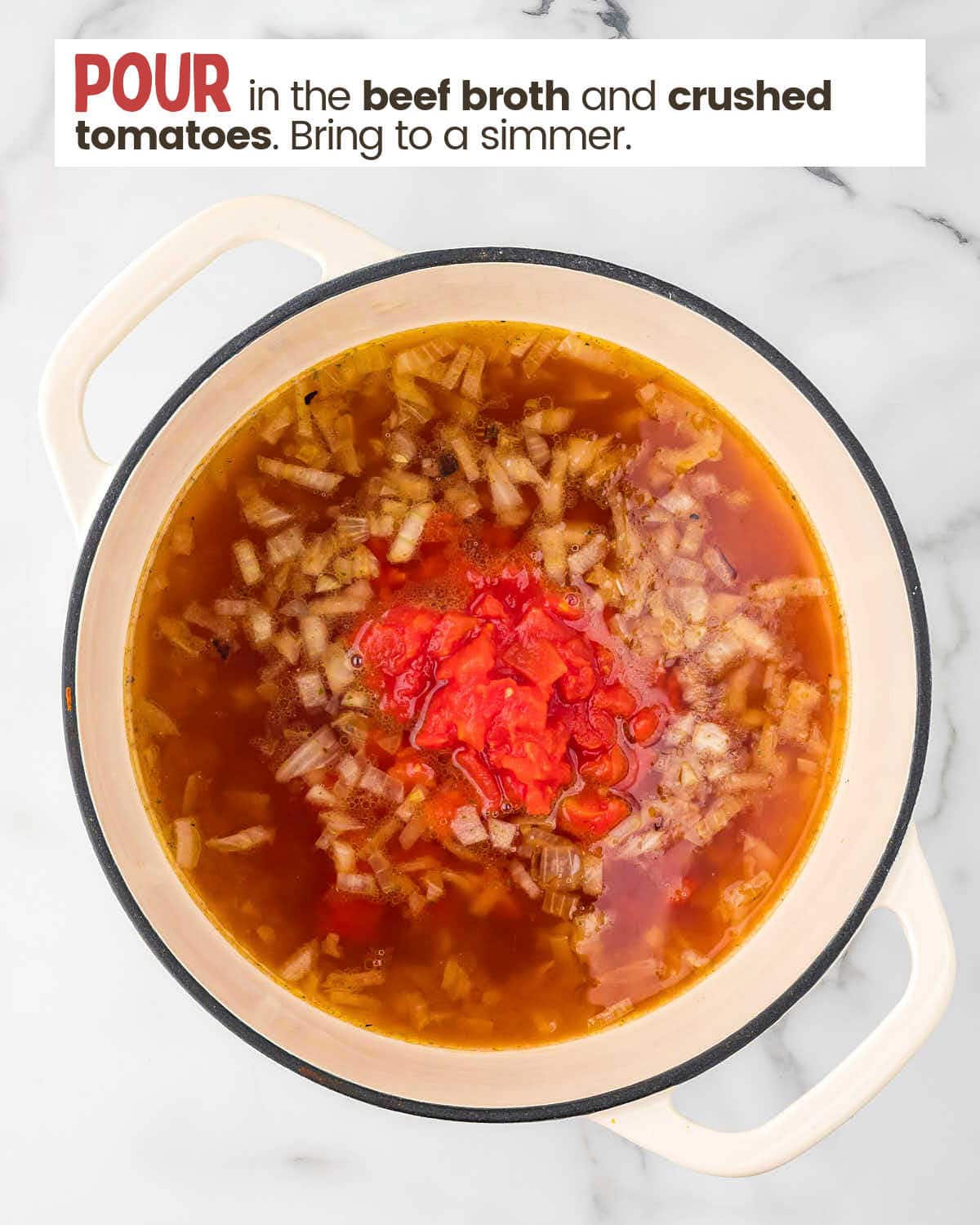 Beef broth and crushed tomatoes added to the base ingredients for ham and bean soup in a large pot.