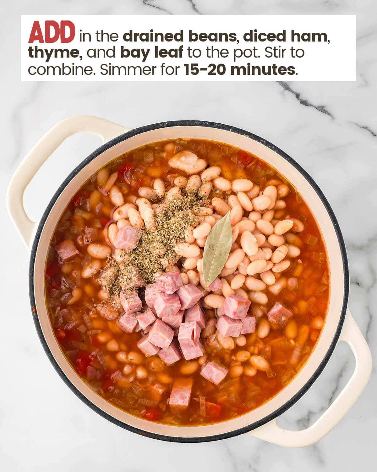 Adding beans, ham, thyme, and a bay leaf to make ham and bean soup in a large pot.