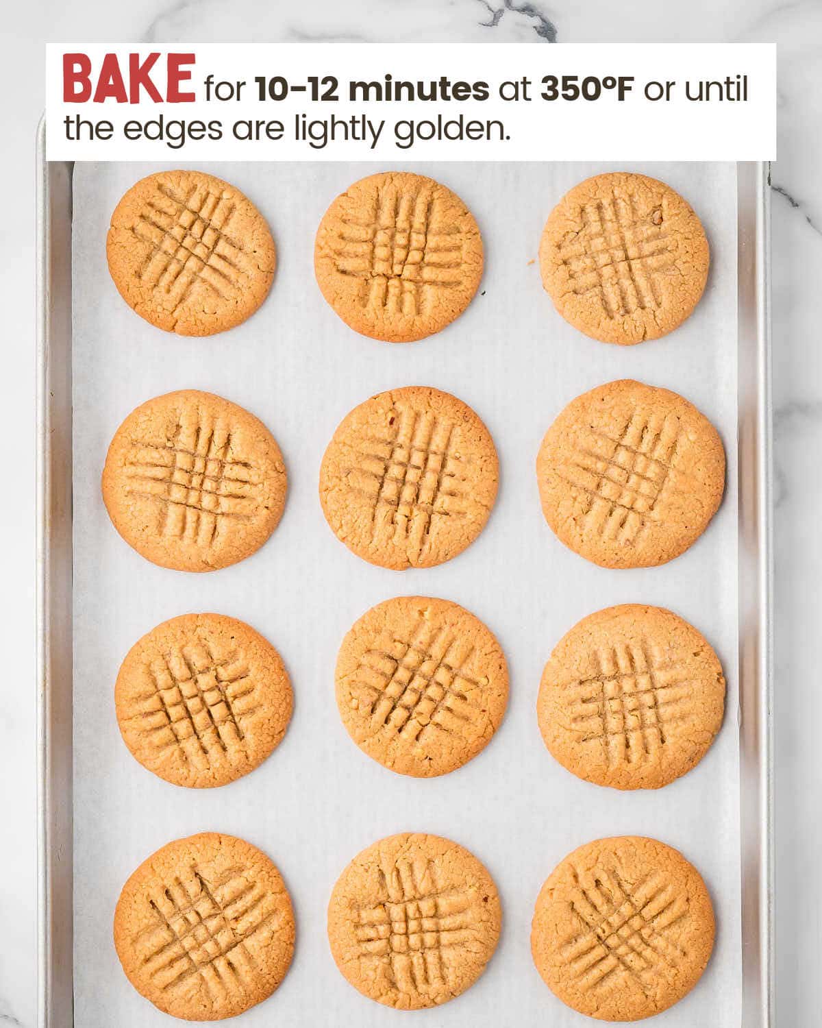 Baked Peanut butter cookies on a baking sheet.