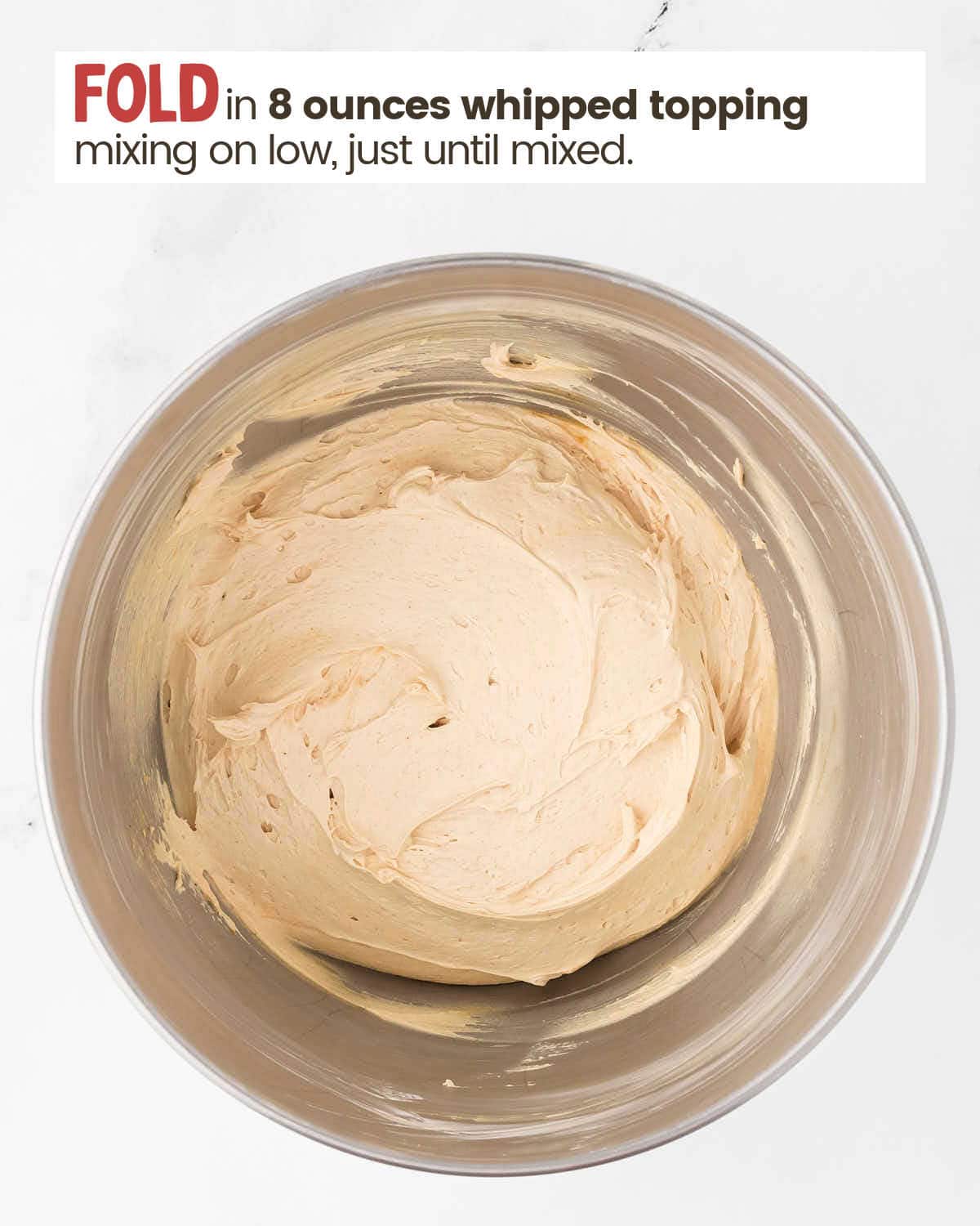 Peanut butter and whipped topping mixture in a bowl.