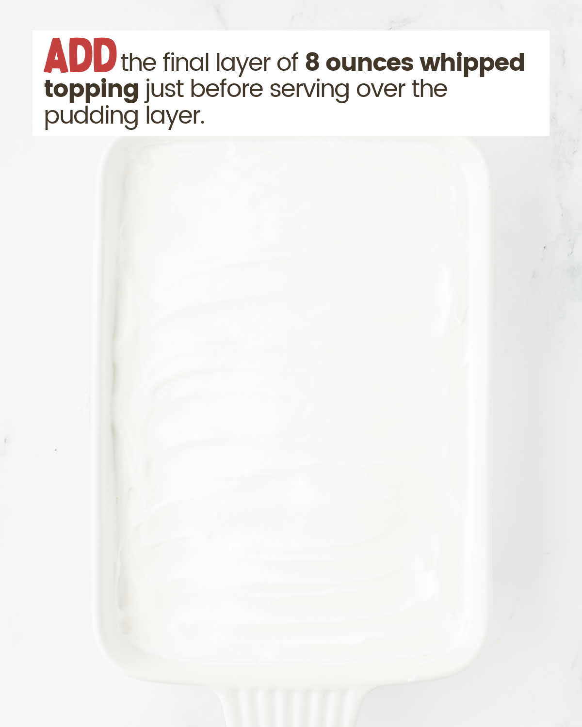 Whipped topping layer in a baking dish.