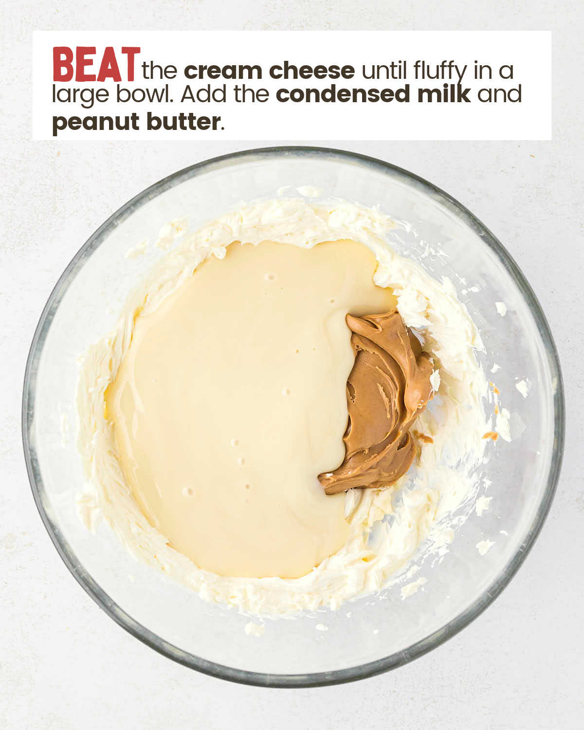 Peanut butter, cream cheese, and condensed milk in a bowl.