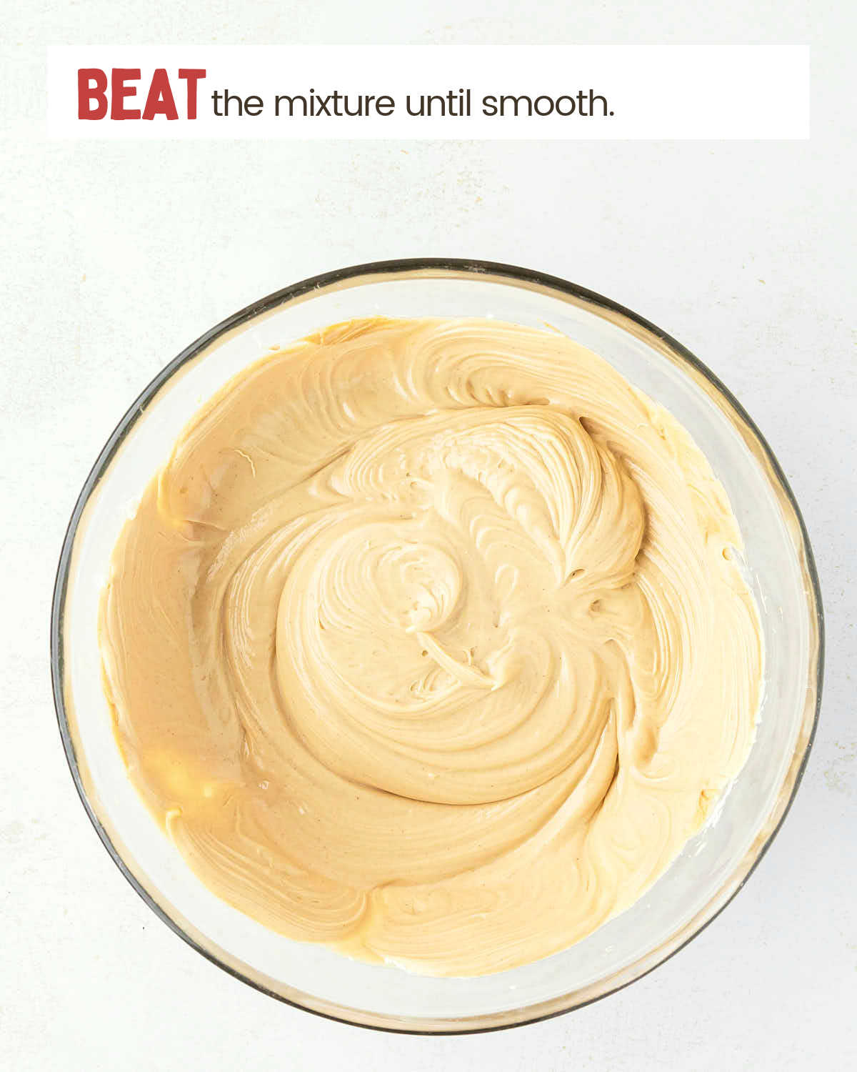 Beaten peanut butter, cream cheese, and condensed milk mixture in a bowl.