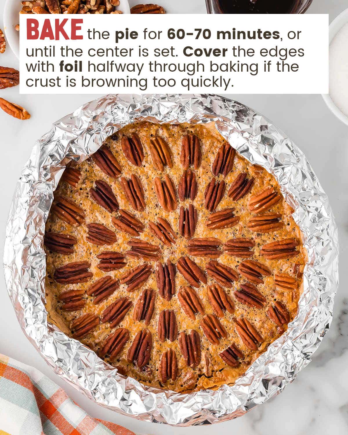 Pecan pie with foil covering the crust.