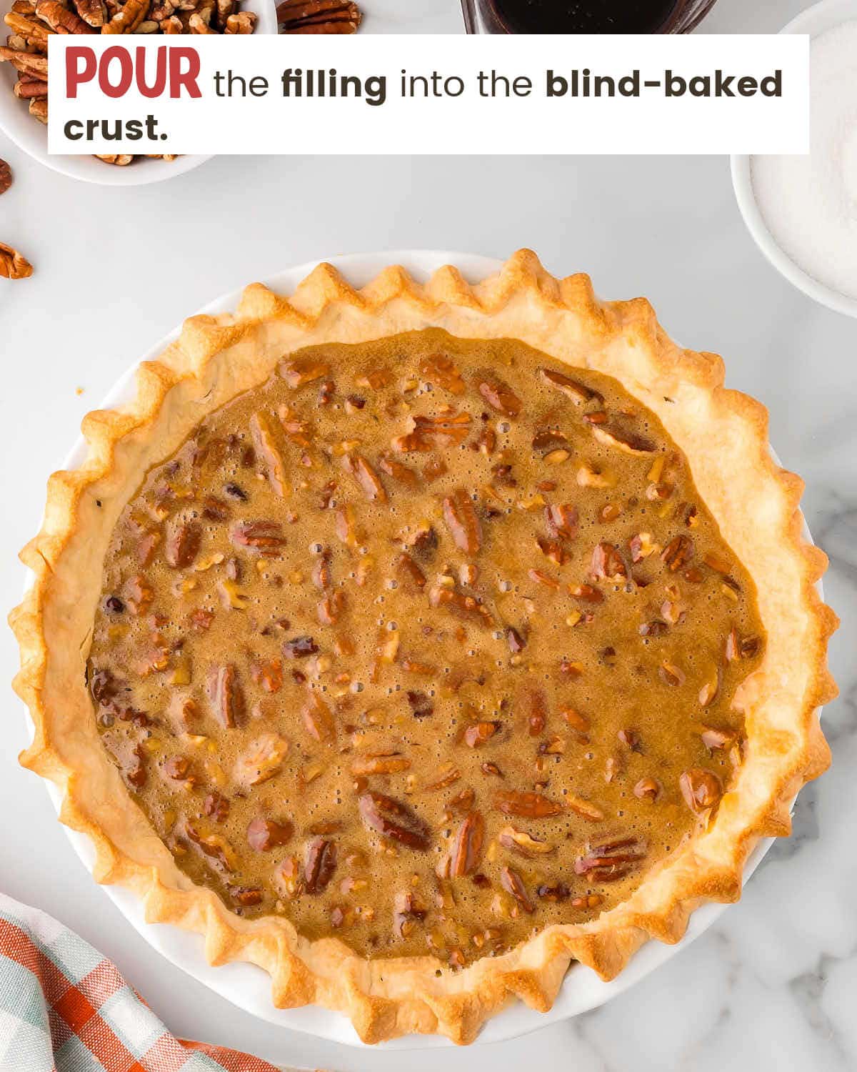 Pecan pie filling in a pie crust.