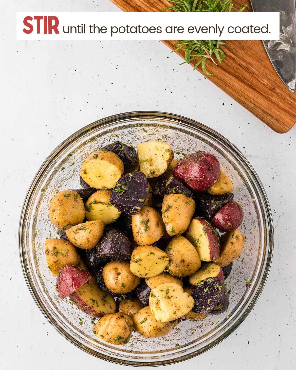 Chopped potatoes and spices in a dish.