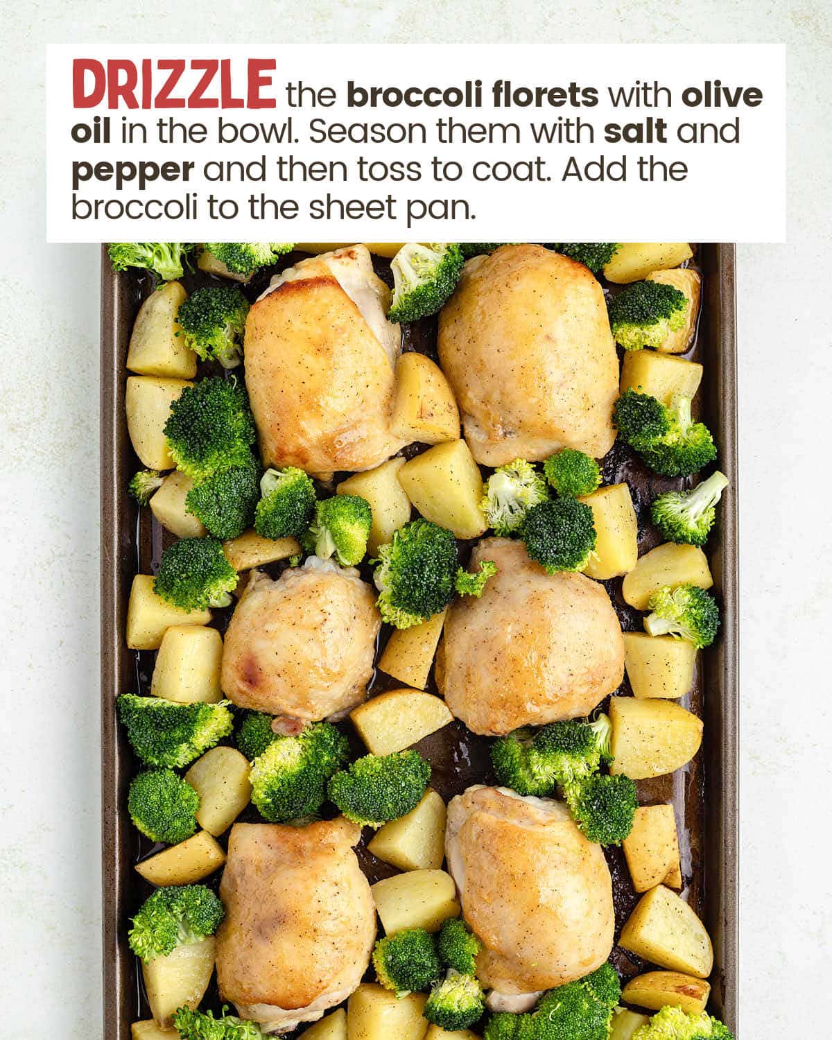 Chicken thighs, broccoli, and potatoes on a sheet pan.