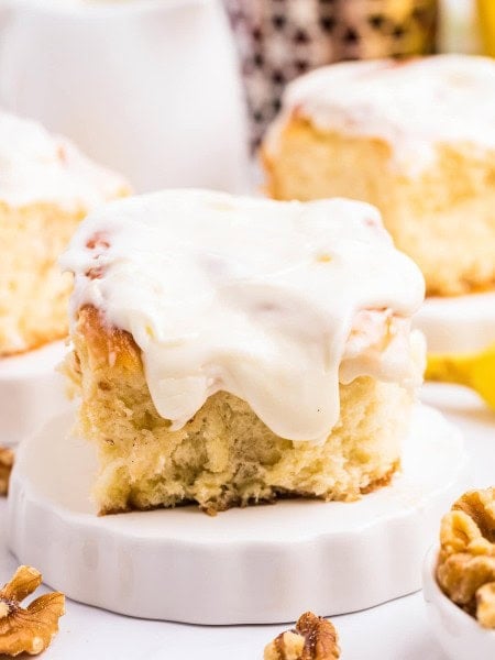 Closeup of a Banana Cinnamon Roll on a white plate.